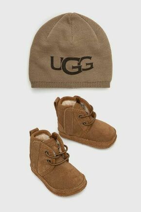 UGG komplet za otroke Baby - rjava. Komplet copati in klobuk iz kolekcije UGG. Model izdelan iz kombinacije tkanine in naravnega usnja.