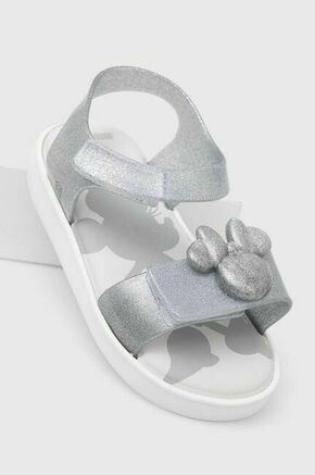 Otroški sandali Melissa JUMP DISNEY 100 BB srebrna barva - srebrna. Otroški sandali iz kolekcije Melissa. Model je izdelan iz sintetičnega materiala. Model z mehkim
