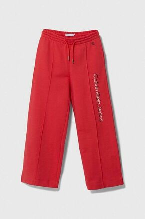 Otroška bombažna trenirka Calvin Klein Jeans rdeča barva - rdeča. Otroški spodnji del trenirke iz kolekcije Calvin Klein Jeans. Model izdelan iz prožnega materiala