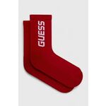 Nogavice Guess ženski, bela barva - rdeča. Visoke nogavice iz kolekcije Guess. Model izdelan iz elastičnega, enobarvnega materiala.