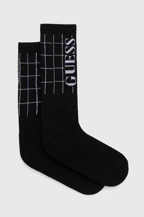 Nogavice Guess Originals bela barva - črna. Visoke nogavice iz kolekcije Guess Originals. Model izdelan iz elastičnega materiala.