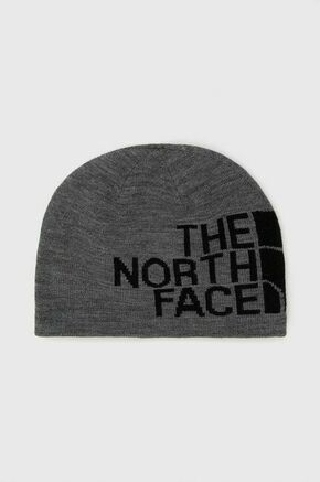 Obojestranska kapa The North Face siva barva - siva. Kapa iz kolekcije The North Face. Model izdelan iz pletenine s potiskom. Izdelek s posebnim dizajnom
