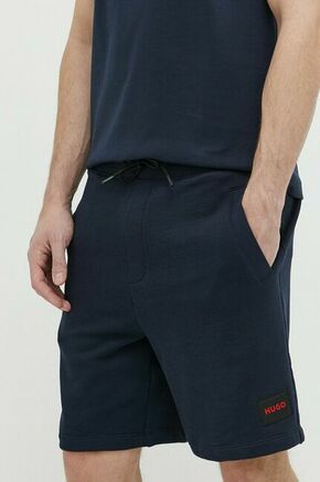 Bombažne kratke hlače HUGO mornarsko modra barva - mornarsko modra. Kratke hlače iz kolekcije HUGO. Model izdelan iz prožnega materiala