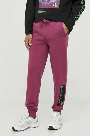 Spodnji del trenirke Calvin Klein Jeans vijolična barva - vijolična. Spodnji del trenirke iz kolekcije Calvin Klein Jeans. Model izdelan iz debele
