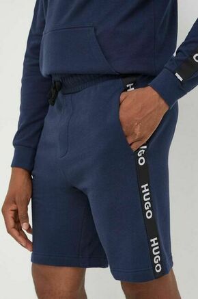Bombažne kratke hlače HUGO - modra. Kratke hlače iz kolekcije HUGO. Model izdelan iz pletenine. Model z mehko oblazinjeno notranjostjo zagotavlja mehkobo in povečuje udobje.
