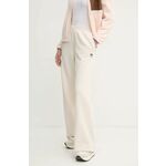 Spodnji del trenirke adidas Originals Femme Galore Wideleg Fleece Pants - bež. Spodnji del trenirke iz kolekcije adidas Originals. Model izdelan iz elastične pletenine. Model iz izjemno udobne tkanine z visoko vsebnostjo bombaža.