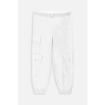 Otroške bombažne hlače Coccodrillo bela barva - bela. Otroški hlače iz kolekcije Coccodrillo. Model izdelan iz bombažne tkanine.