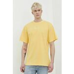 Bombažna kratka majica Karl Kani moški, rumena barva - rumena. Ohlapna kratka majica iz kolekcije Karl Kani, izdelana iz pletenine, prijetne na otip. Model iz izjemno udobne bombažne tkanine.