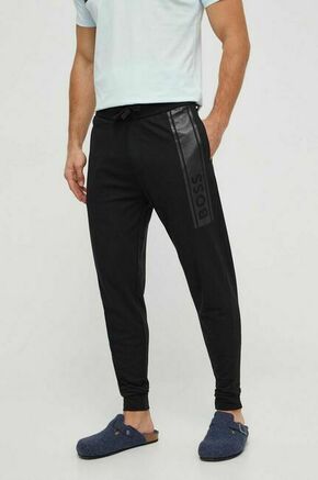 Bombažne hlače BOSS črna barva - črna. Hlače bootcut iz kolekcije BOSS. Model izdelan iz elastične pletenine. Model iz izjemno udobne bombažne tkanine.