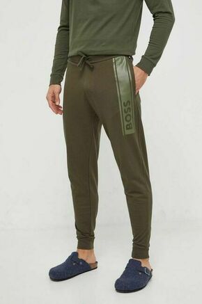 Bombažne hlače BOSS zelena barva - zelena. Hlače bootcut iz kolekcije BOSS. Model izdelan iz elastične pletenine. Model iz izjemno udobne bombažne tkanine.