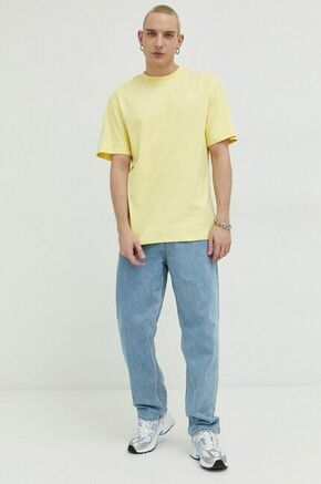 Bombažna kratka majica Karl Kani rumena barva - rumena. Ohlapna kratka majica iz kolekcije Karl Kani. Model izdelan iz tanke