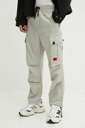 Bombažne hlače HUGO siva barva - siva. Hlače iz kolekcije HUGO. Model izdelan iz enobarvne tkanine. Model iz izjemno udobne bombažne tkanine.