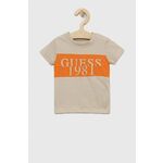 Otroška bombažna kratka majica Guess bež barva - bež. Otroški kratka majica iz kolekcije Guess. Model izdelan iz pletenine s potiskom. Lahek material, namenjen za toplejše letne čase.