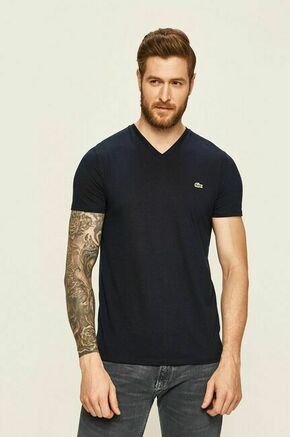 Lacoste t-shirt - mornarsko modra. T-shirt iz kolekcije Lacoste. Model izdelan iz enobarvne pletenine.