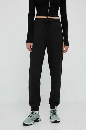 Spodnji del trenirke Calvin Klein Jeans črna barva - črna. Spodnji del trenirke iz kolekcije Calvin Klein Jeans. Model izdelan iz elastične pletenine. Model iz izjemno udobne tkanine z visoko vsebnostjo bombaža.