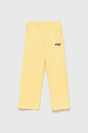 Otroške trenirka hlače Guess rumena barva - rumena. Otroško Trenirka hlače iz kolekcije Guess. Model izdelan iz tanke