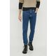 Kavbojke Calvin Klein Jeans moški - modra. Kavbojke iz kolekcije Calvin Klein Jeans slim taper fit kroja, z normalnim pasom. Model izdelan iz spranega denima. Trden material, ki ohranja obliko.