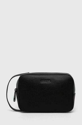 Kozmetična torbica Calvin Klein črna barva - črna. Velika kozmetična torbica iz kolekcije Calvin Klein. Model izdelan iz ekološkega usnja. Model je enostaven za čiščenje in vzdrževanje.