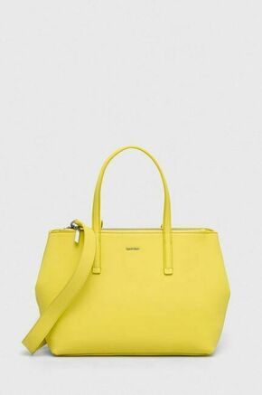 Torbica Calvin Klein rumena barva - rumena. Velika torbica iz kolekcije Calvin Klein. Model na zapenjanje