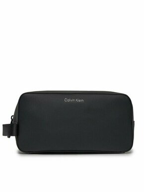 Kozmetična torbica Calvin Klein črna barva - črna. Toaletna torbica iz kolekcije Calvin Klein. Model izdelan iz ekološkega usnja.