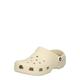 Natikači Crocs Classic moški, bež barva, 10001 - bež. Natikači iz kolekcije Crocs. Model izdelan iz sintetičnega materiala. Zgornji del je neporozen, zlahka ga očistite z vlažno krpo.