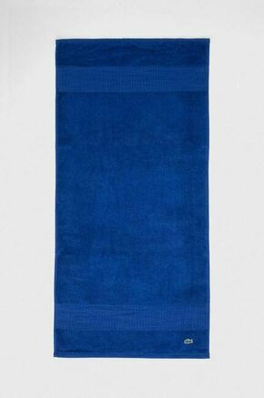 Brisača Lacoste 50 x 100 cm - modra. Brisača iz kolekcije Lacoste. Model izdelan iz tekstilnega materiala.