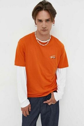 Bombažna kratka majica Tommy Jeans oranžna barva - oranžna. Lahkotna kratka majica iz kolekcije Tommy Jeans