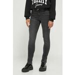 Kavbojke Tommy Jeans ženski, črna barva - črna. Kavbojke iz kolekcije Tommy Jeans skinny kroja, z normalnim pasom. Model izdelan iz elastičnega denima.