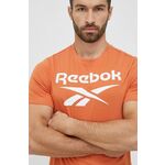 Bombažna kratka majica Reebok oranžna barva - oranžna. Kratka majica iz kolekcije Reebok. Model izdelan iz elastične pletenine. Visokokakovosten, udoben material.