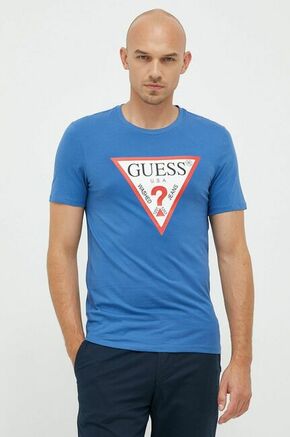 Bombažen t-shirt Guess zelena barva - modra. Prilagojen T-shirt iz kolekcije Guess. Model izdelan iz tanke