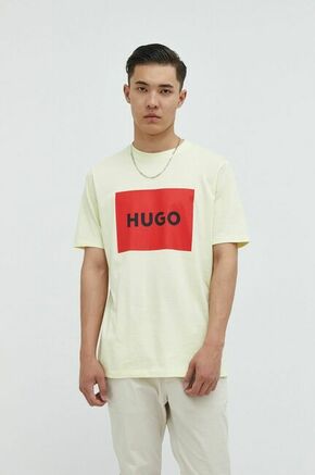 Bombažen t-shirt HUGO bež barva - rumena. Ohlapen T-shirt iz kolekcije HUGO. Model izdelan iz tanke