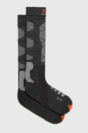 Smučarske nogavice X-Socks Ski Silk Merino 4.0 - siva. Smučarske nogavice iz kolekcije X-Socks. Model izdelan iz materiala za izolacijo pred mrazom s primesjo merino volne in svile.