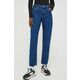Kavbojke Tommy Jeans ženski - modra. Kavbojke iz kolekcije Tommy Jeans slim kroja, z visokim pasom. Model izdelan iz enobarvnega denima. Izjemno udobna tkanina z visoko vsebnostjo bombaža.
