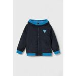Otroška jakna Guess mornarsko modra barva - mornarsko modra. Otroški jakna iz kolekcije Guess. Nepodložen model, izdelan iz gladke tkanine. Lahkoten in prijeten material, namenjen toplejšim letnim časom.