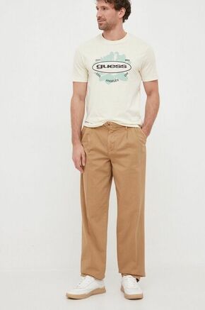 Bombažne hlače Tommy Hilfiger x Shawn Mendes rjava barva - rjava. Hlače iz kolekcije Tommy Hilfiger. Model izdelan iz enobarvnega materiala. Izjemno udoben material