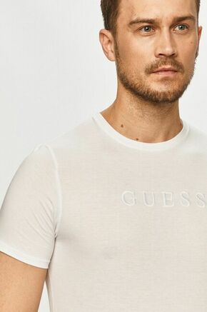 Bombažen t-shirt Guess - bela. T-shirt iz kolekcije Guess. Model izdelan iz tanke
