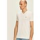 Lacoste t-shirt - bela. T-shirt iz kolekcije Lacoste. Model izdelan iz enobarvne pletenine.