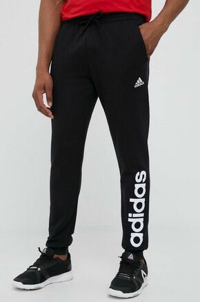 Adidas Spodnji del trenirke Essentials French Terry Tapered Cuff Logo Joggers IC0063 Črna Regular Fit