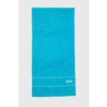 Bombažna brisača BOSS Plain River Blue 50 x 100 cm - modra. Brisača iz kolekcije BOSS. Model izdelan iz bombažne tkanine.