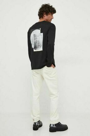 Bombažna majica z dolgimi rokavi Calvin Klein črna barva - črna. Majica z dolgimi rokavi iz kolekcije Calvin Klein. Model izdelan iz pletenine s potiskom. Model iz izjemno udobne bombažne tkanine.