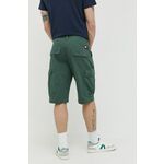 Bombažne kratke hlače Tommy Jeans zelena barva - zelena. Kratke hlače iz kolekcije Tommy Jeans. Model izdelan iz enobarvnega materiala. Bombažen, udoben material.