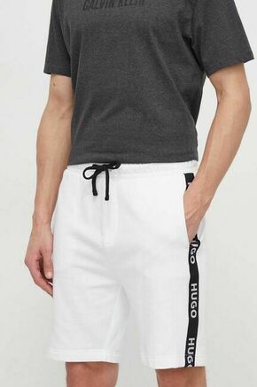 Bombažne kratke hlače HUGO bela barva - bela. Kratke hlače iz kolekcije HUGO. Model izdelan iz pletenine. Model z mehko oblazinjeno notranjostjo zagotavlja mehkobo in povečuje udobje.