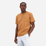 Bombažna kratka majica New Balance oranžna barva - oranžna. Kratka majica iz kolekcije New Balance, izdelana iz enobarvne pletenine. Model iz izjemno udobne bombažne tkanine.