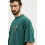 Bombažna kratka majica Champion moška, zelena barva, 219999 - zelena. Kratka majica iz kolekcije Champion, izdelana iz pletenine z nalepko. Model iz izjemno udobne bombažne tkanine.